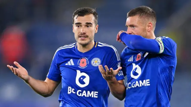 Jamie Vardy of Leicester City speaks to teammate Harry Winks at the end of the Premier League match between Leicester City FC and Nottingham Forest FC at The King Power Stadium