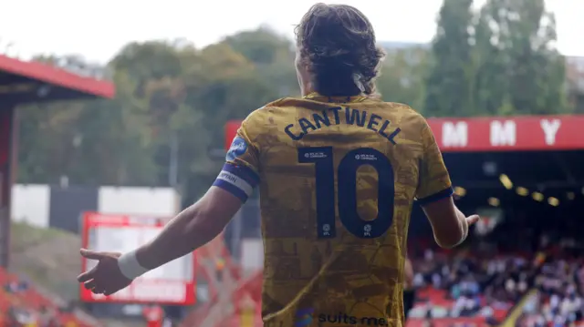 Blackburn Rovers captain Todd Cantwell holds his arms out in an appeal to the referee