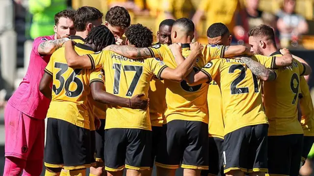 Wolves players huddle