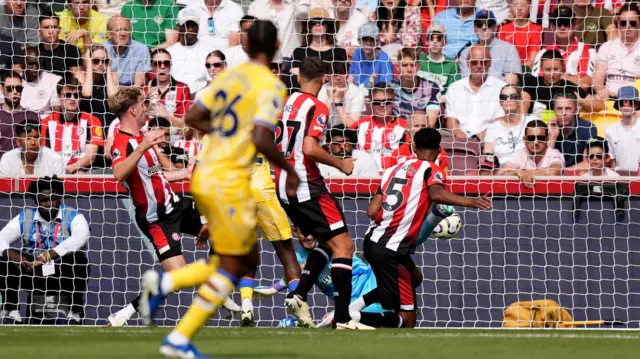 Brentford's Ethan Pinnock scores an own goal against Crystal Palace