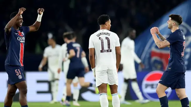 William Pacho and Lucas Beraldo of Paris Saint-Germain celebrate either side of Ollie Watkins of Aston Villa