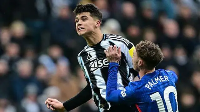 Lewis Miley heading the ball against Chelsea