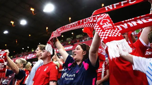 Nottingham Forest fans hold up scarves