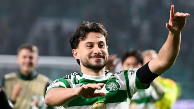 Nicolas Kuhn celebrates with Celtic fans