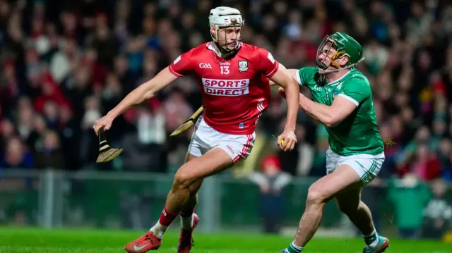 Alan Walsh of Cork in action against Sean Finn of Limerick
