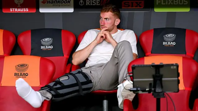 Dejan Kulusevski sits in the dugout with his knee in a brace prior to the Europa League Final against Manchester United