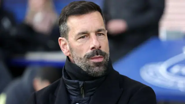 Ruud van Nistelrooy looks on from dugout