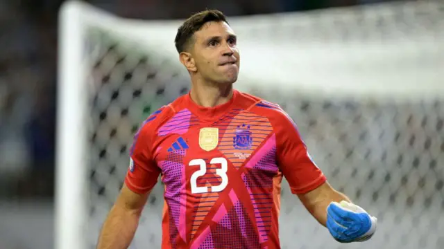 Aston Villa's Emi Martinez celebrates saving a penalty in Argentina's shootout win versus Ecuador