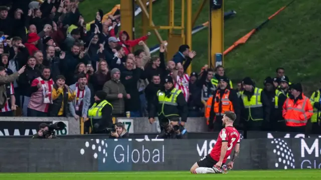 Ryan Manning celebrates in front of fans 