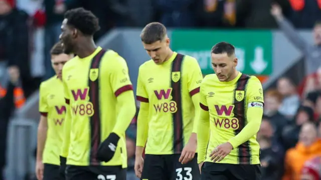 Burnley's Josh Brownhill and teammates react to conceding a third goal during the Premier League match between Liverpool FC and Burnley FC at Anfield 