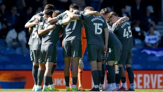Cardiff City  players in a huddle