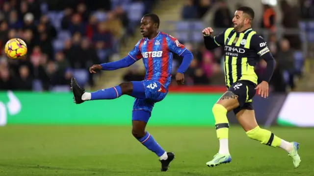 Tyrick Mitchell and and Kyle Walker compete for the ball