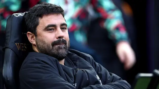 Vitor Matos sitting in the dugout 