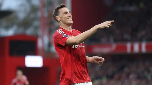 Nottingham Forest's Chris Wood celebrates scoring his side's first goal during the Premier League match between Nottingham Forest FC and West Ham United FC at City Ground