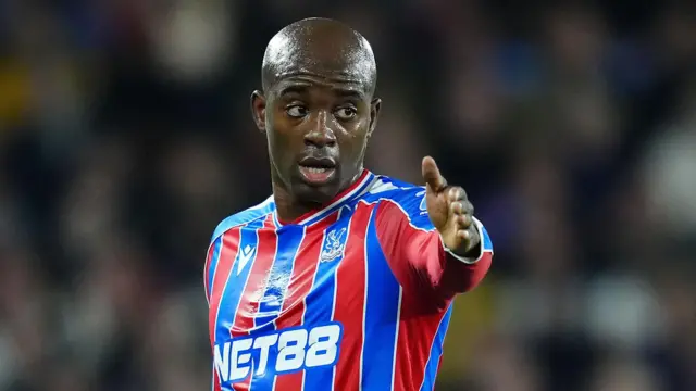 Jean-Philipe Mateta pointing while in action for Crystal Palace
