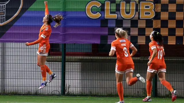 Natalia Wrobel jumps in the air to celebrate scoring for Glasgow City against Sporting Club in the Europa Cup