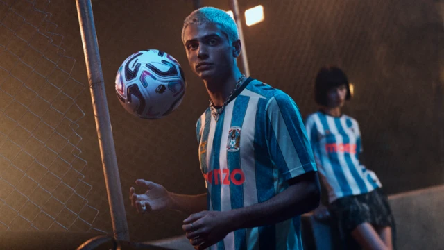 Coventry City's new shirt for the 2026-27 Premier League season. Blue nd white stripes with a black collar.