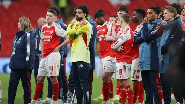 Arsenal players look dejected