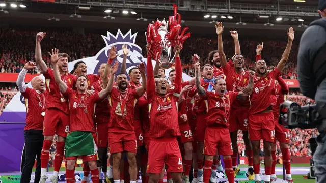 Liverpool lifting the Premier League trophy