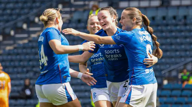 Rangers' Kirsty Howat celebrates scoring to make it 3-0 with teammates 
