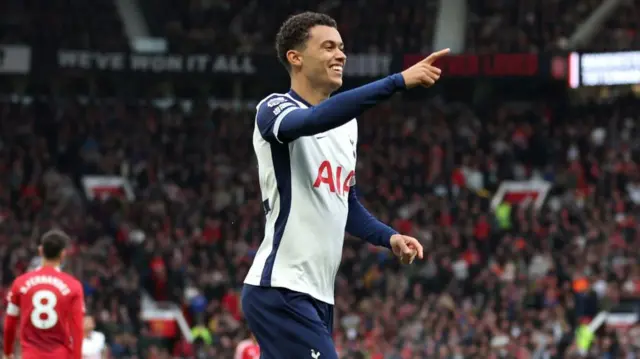 Brennan Johnson of Tottenham Hotspur celebrates scoring his team's first goal during the Premier League match between Manchester United FC and Tottenham Hotspur FC at Old Trafford