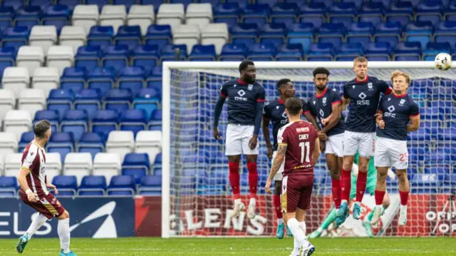 St Johnstone's Nicky Clark scores from a free kick to make it 3-1 during a William Hill Scottish Premiership match between Ross County and St Johnstone at the Global Energy Stadium