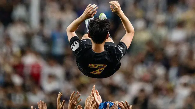 Son Heung-min is thrown into the air by his teammates 