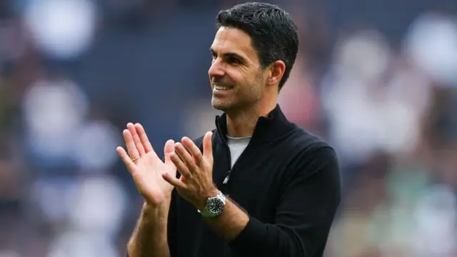 Mikel Arteta applauds Arsenal fans after Gunners beat Tottenham Hotspur. 