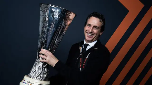 Unai Emery holds Europa League trophy