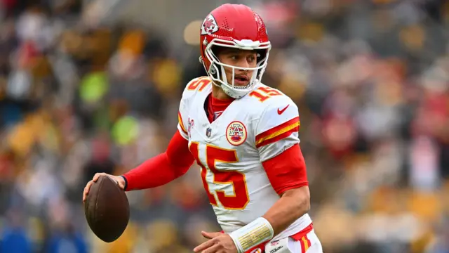 Kansas City Chiefs quarterback Patrick Mahomes wearing his team's white uniforms during a game, as they will in the Super Bowl