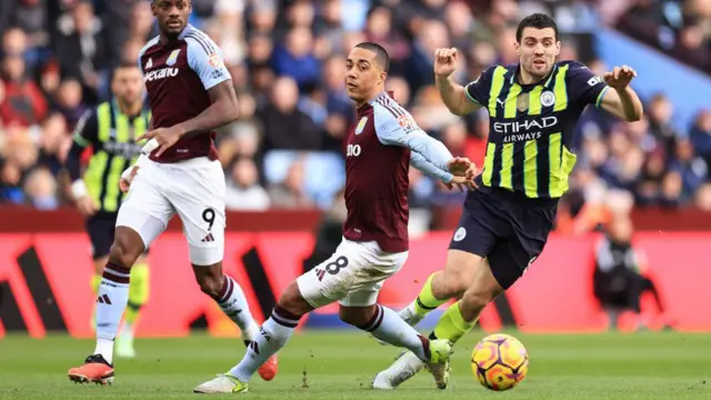 Youri Tielemans of Aston Villa and Mateo Kovacic of Manchester City during the Premier League match between Aston Villa FC and Manchester City FC at Villa Park on December 21, 2024