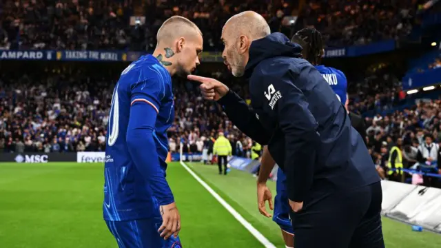 Enzo Maresca, Manager of Chelsea, interacts with Mykhailo Mudryk