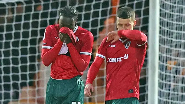 Kieron Evans (right) and Cameron Antwi of Newport County react as Port Vale score the winning goal 