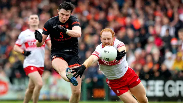 Ben Crealey and Conor Glass in action as Armagh edged past Derry in their opening All-Ireland round-robin clash. 