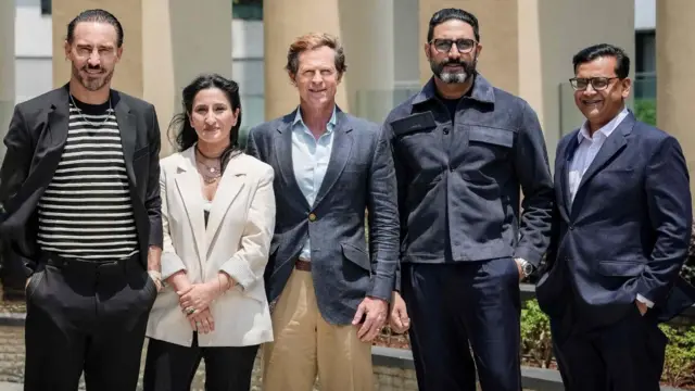 Faf du Plessis and Jonty Rhodes with Abhishek Bachchan and members of the ETPL team