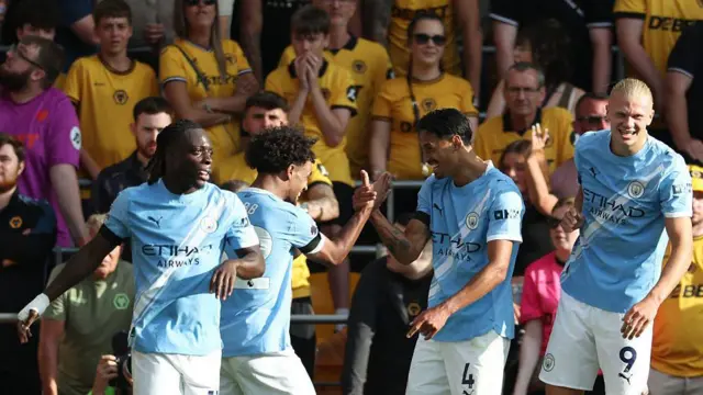Erling Haaland, Oscar Bobb and Tijjani Reijnders celebrate scoring 