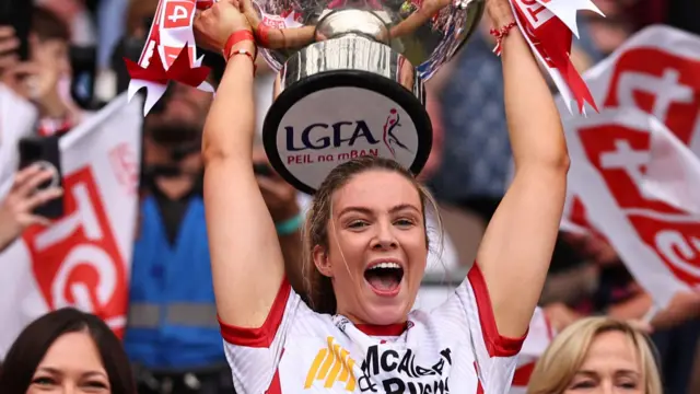 Tyrone captain Aoibhinn McHugh lifts the Mary Quinn Memorial Cup