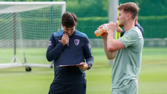 Andoni Iraola looking at his pre-season notes