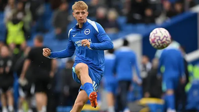 Tommy Watson plays a pass during a Brighton warm-up