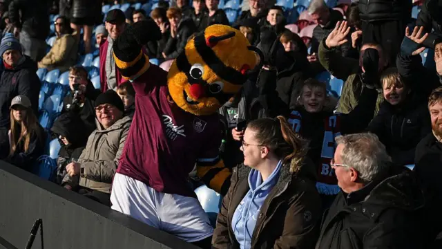 The Bertie The Bee mascot entertains fans