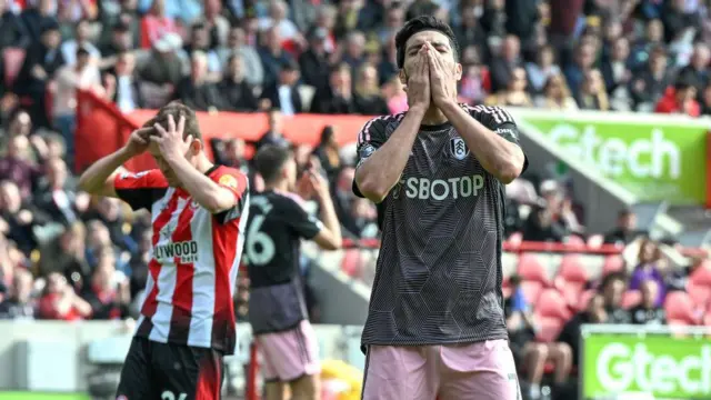 Raul Jimenez hides his face in disbelief