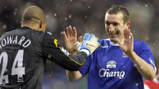 Everton's Alan Stubbs (R) celebrates with Tim Howard after their English Premiership football match at Goodison Park
