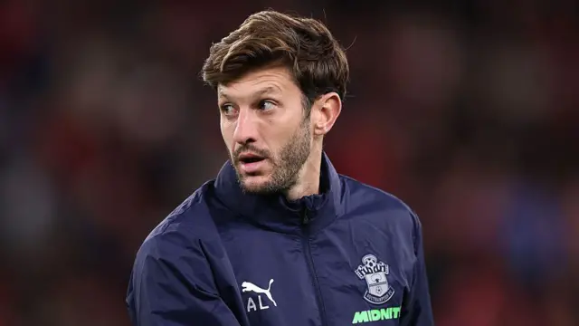 Southampton's Adam Lallana looks on from the sidelines 