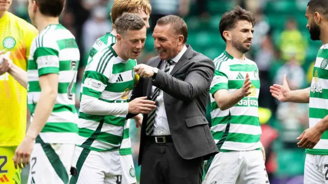 Brendan Rodgers speaks with Callum McGregor
