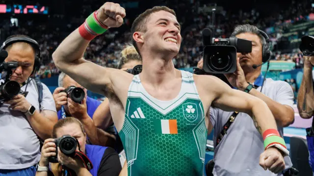 Rhys McClenaghan celebrates after his pommel horse triumph at the Olympic Games in Paris