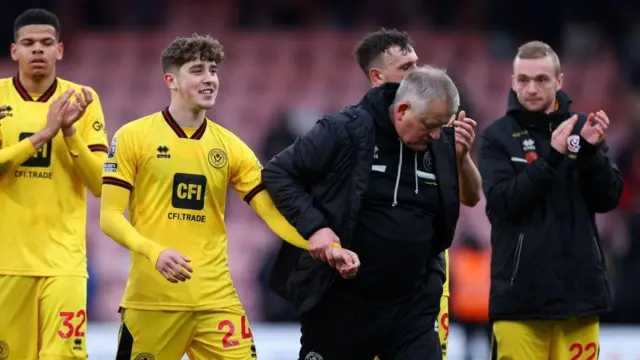 Chris Wilder, Manager of Sheffield United, interacts with Oliver Luke Arblaster