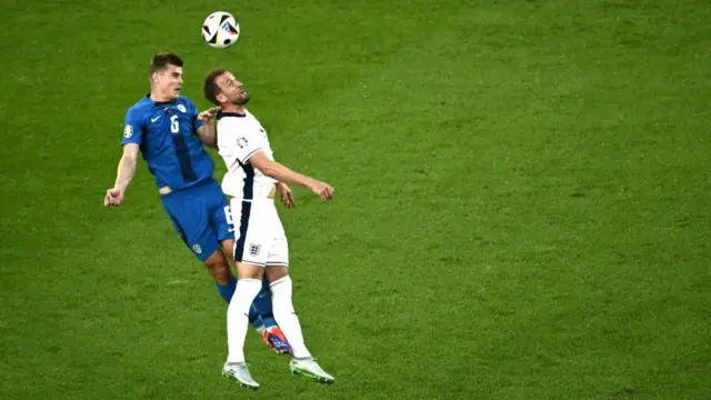 Jaka Bijol and Harry Kane compete for the ball at Euro 2024