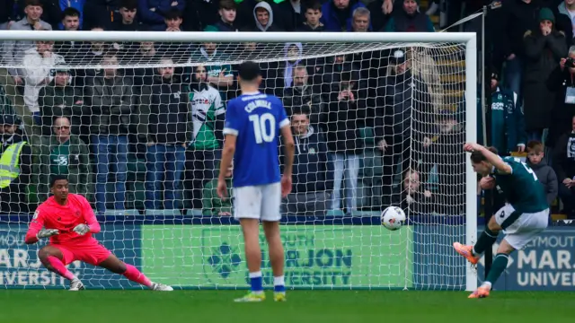 Lorent Tolaj of Plymouth Argyle scores from the penalty spot against Cardiff 