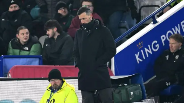 Leicester manager Ruud van Nistelrooy looking down