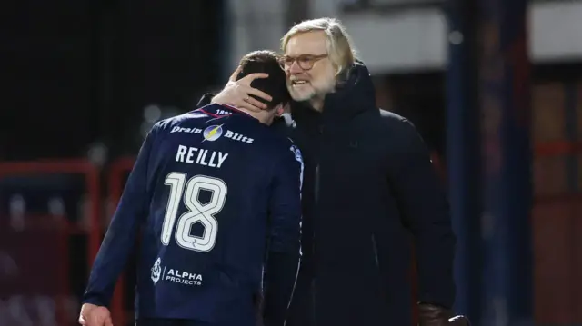 Steven Pressley hugs Charlie Reilly after substituting the game-winner